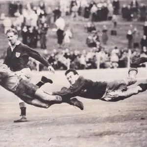 Balmain winger Bobby Lulham dives over the line to score against Newtown at the Sydney Cricket Ground.