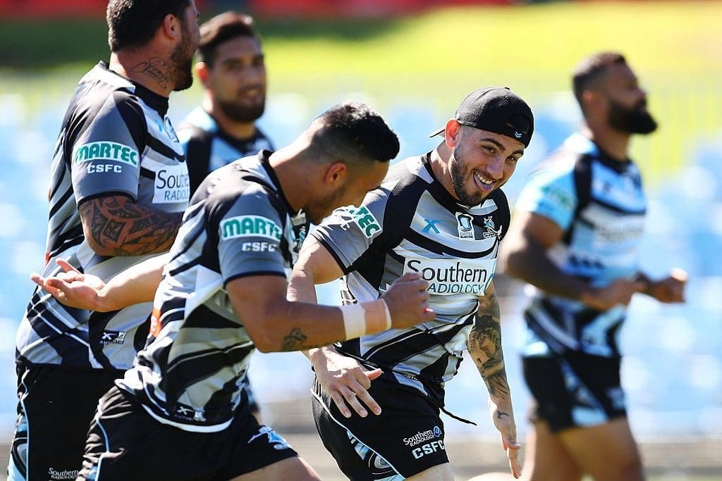 SYDNEY, AUSTRALIA - SEPTEMBER 26: Jack Bird of the Sharks shares a joke with team mate Valentine Holmes during a Cronulla Sharks NRL training session at Southern Cross Group Stadium on September 26, 2016 in Sydney, Australia. (Photo by Brendon Thorne/Getty Images)